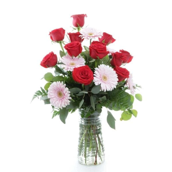 Sweet-Surprise-$64.99-Dozen-Roses,-Gerbera-Daisies,-Assorted-Greens-8-10in-Vase-(Container-may-vary)-Approx-18Hx10W