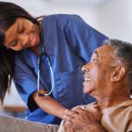 Senior man, volunteer nurse or support caregiver help with elderly in medical nursing home