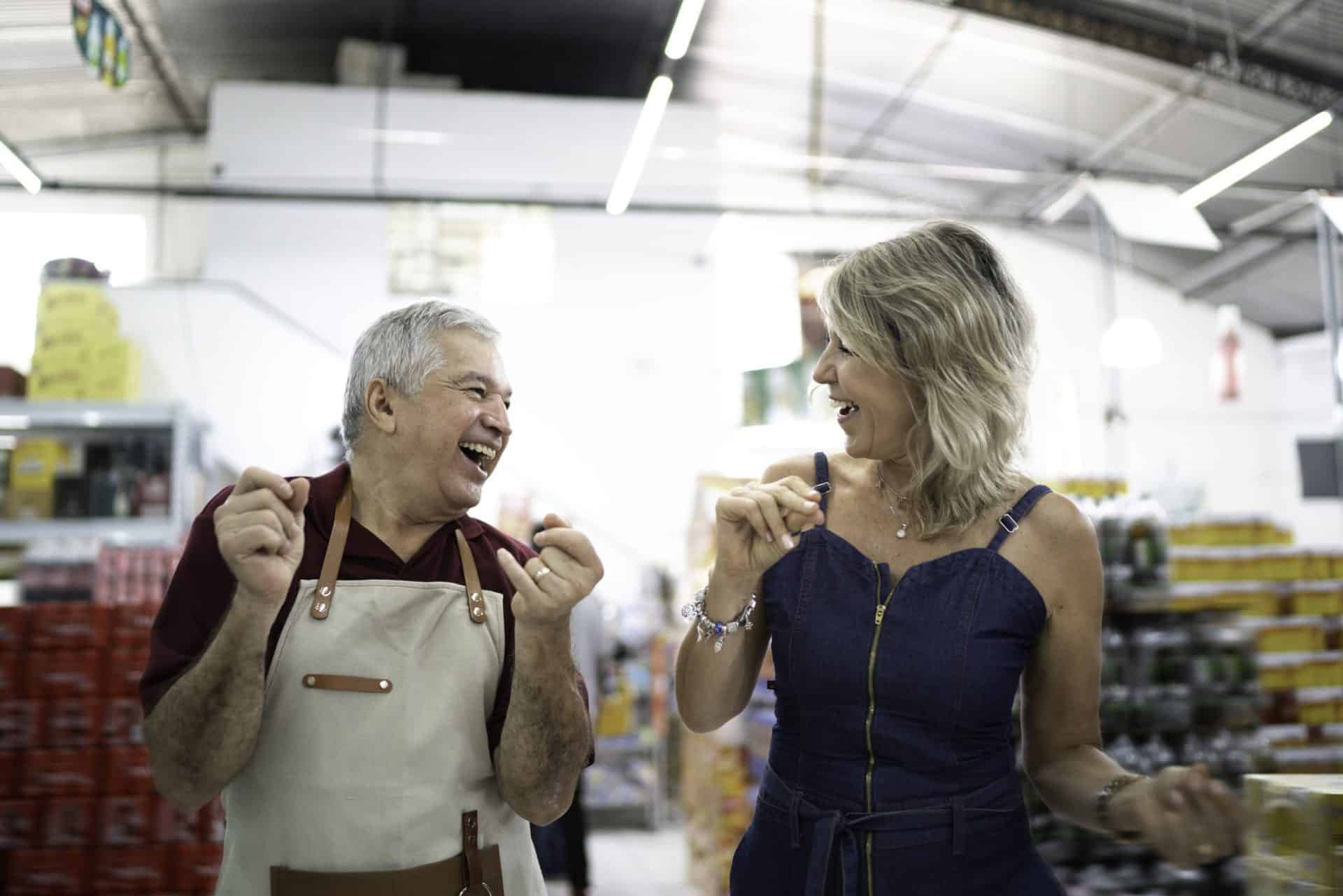 Customer and employee dancing at wholesale