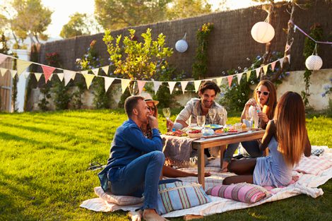 People sitting outside at a picnic